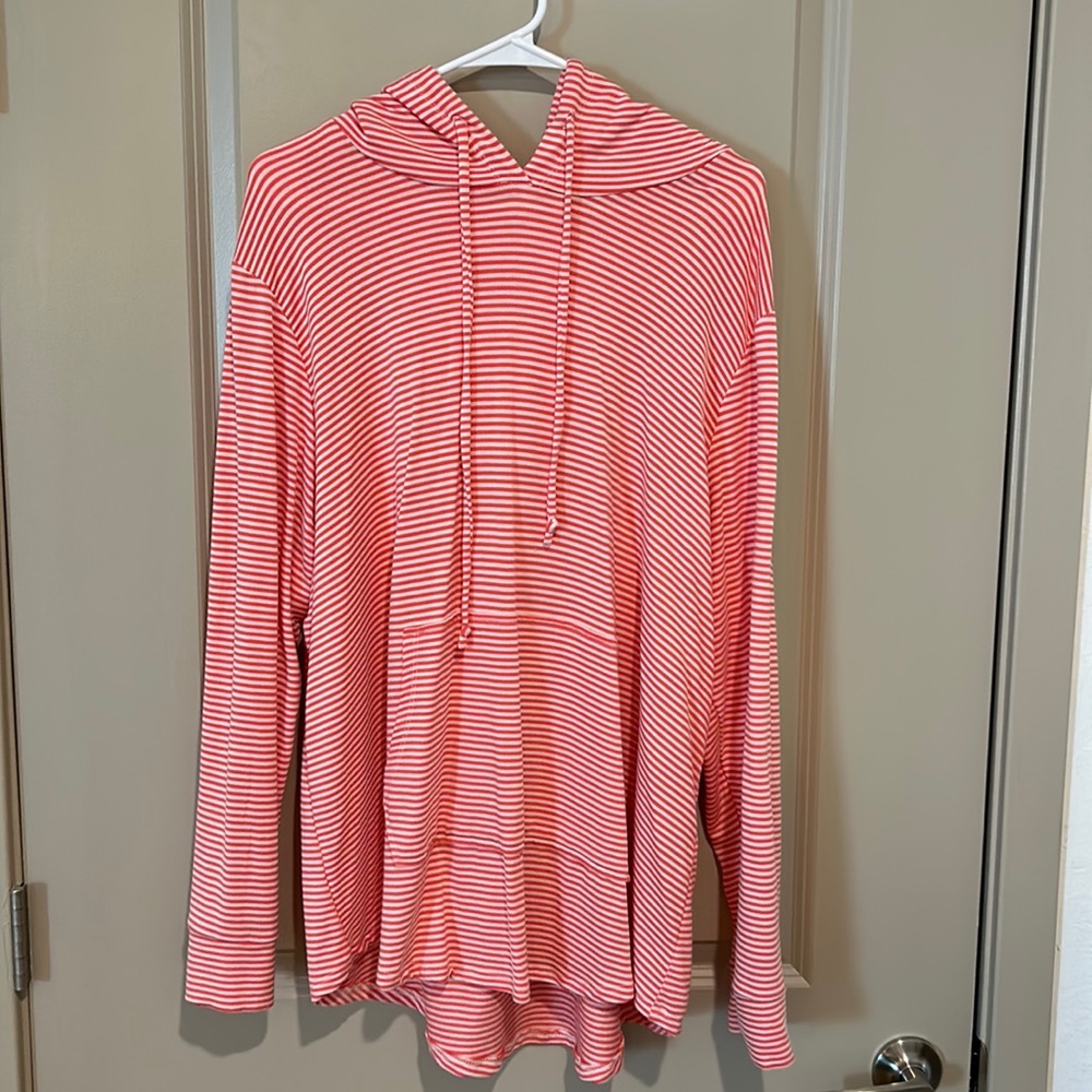 Women’s long sleeve orange striped top. Drawstring with hood